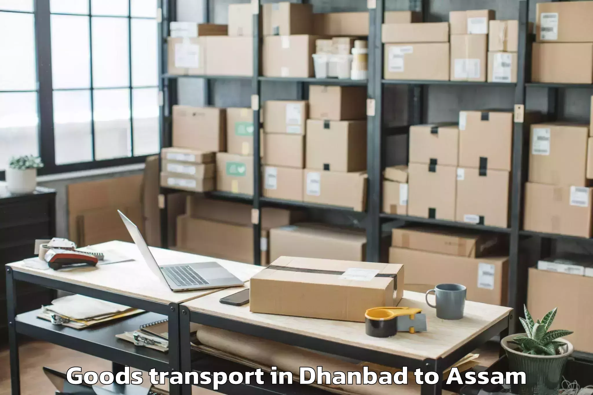 Top Dhanbad to Chaparmukh Goods Transport Available